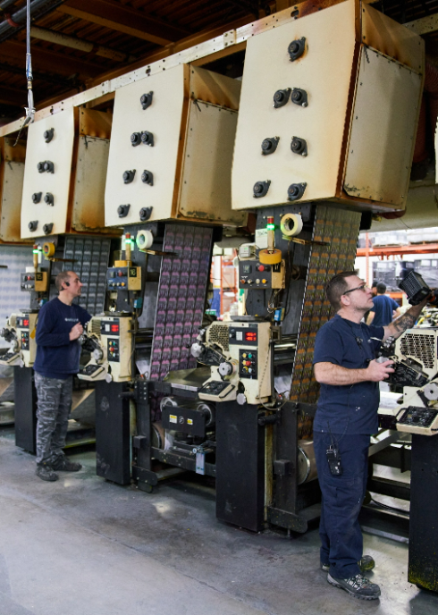 two men working on the printing floor